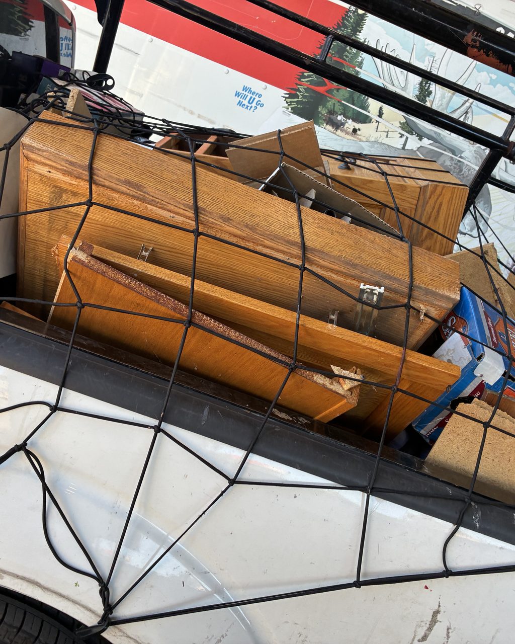 Truck bed loaded with hauled furniture and junk